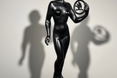 Nude statue holding the Skoda logo.
