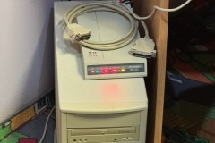 Hyundai 2400BPM modem atop a cream tower PC case.