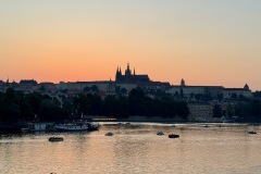 Distant view of Prague Castle at sunset.