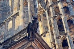 Close-up of gargoyles and buttresses.